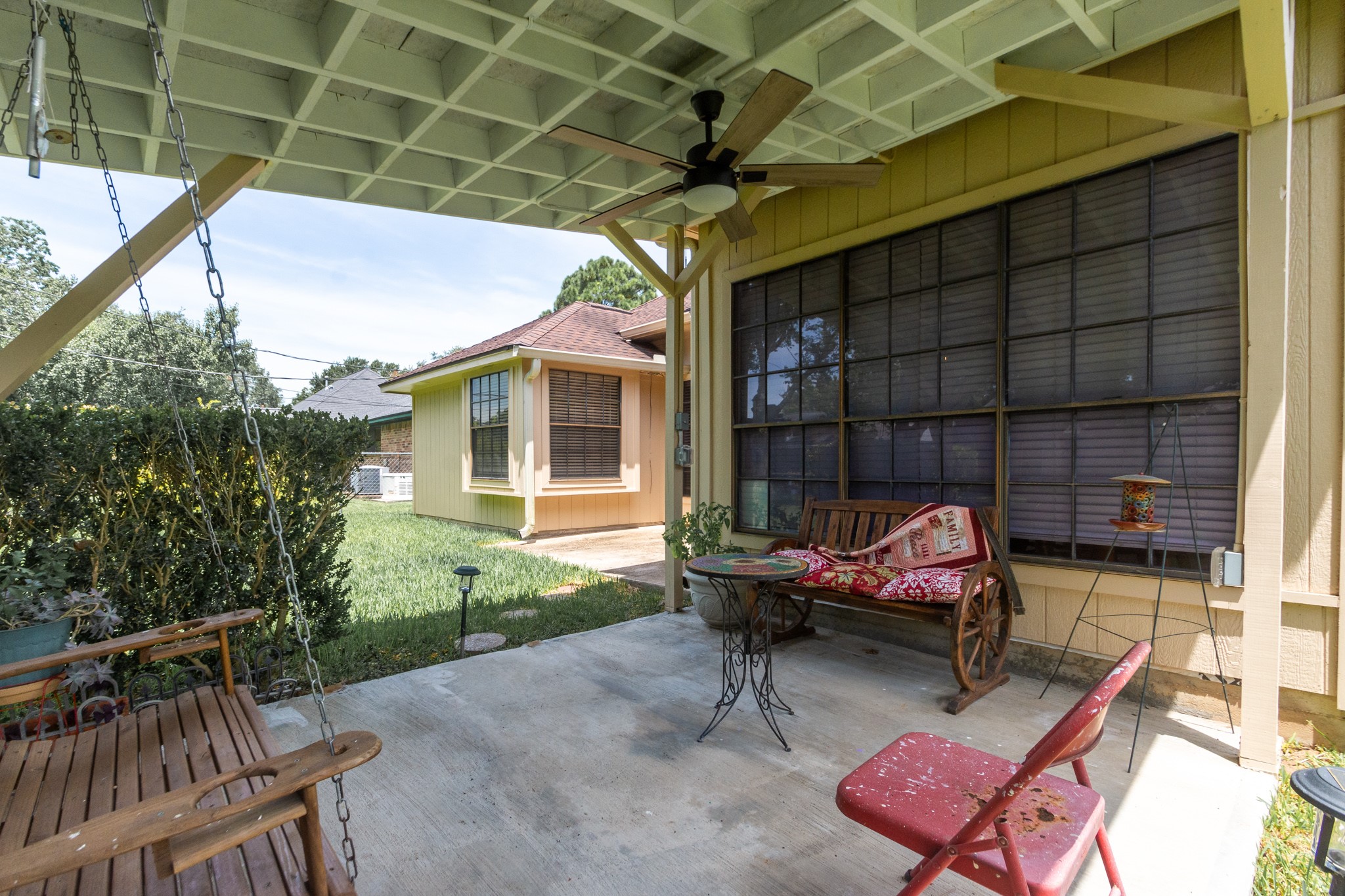 808 Manor Drive Angleton, TX 77515 - Photo 25 of 31 a backyard of a house with outdoor seating