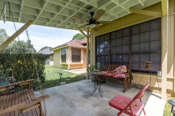 a backyard of a house with outdoor seating