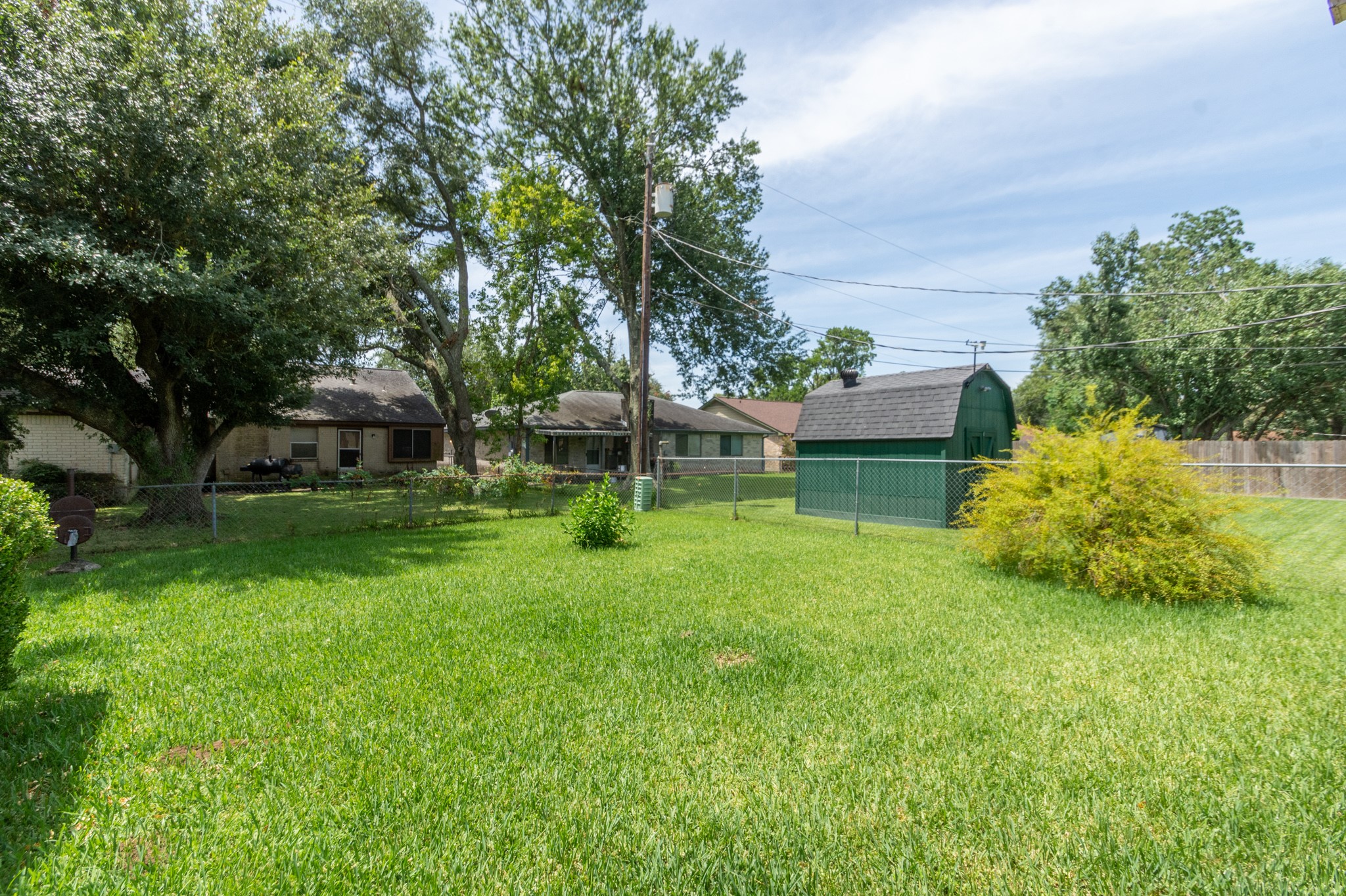 808 Manor Drive Angleton, TX 77515 - Photo 28 of 31 a view of a house with backyard and sitting area