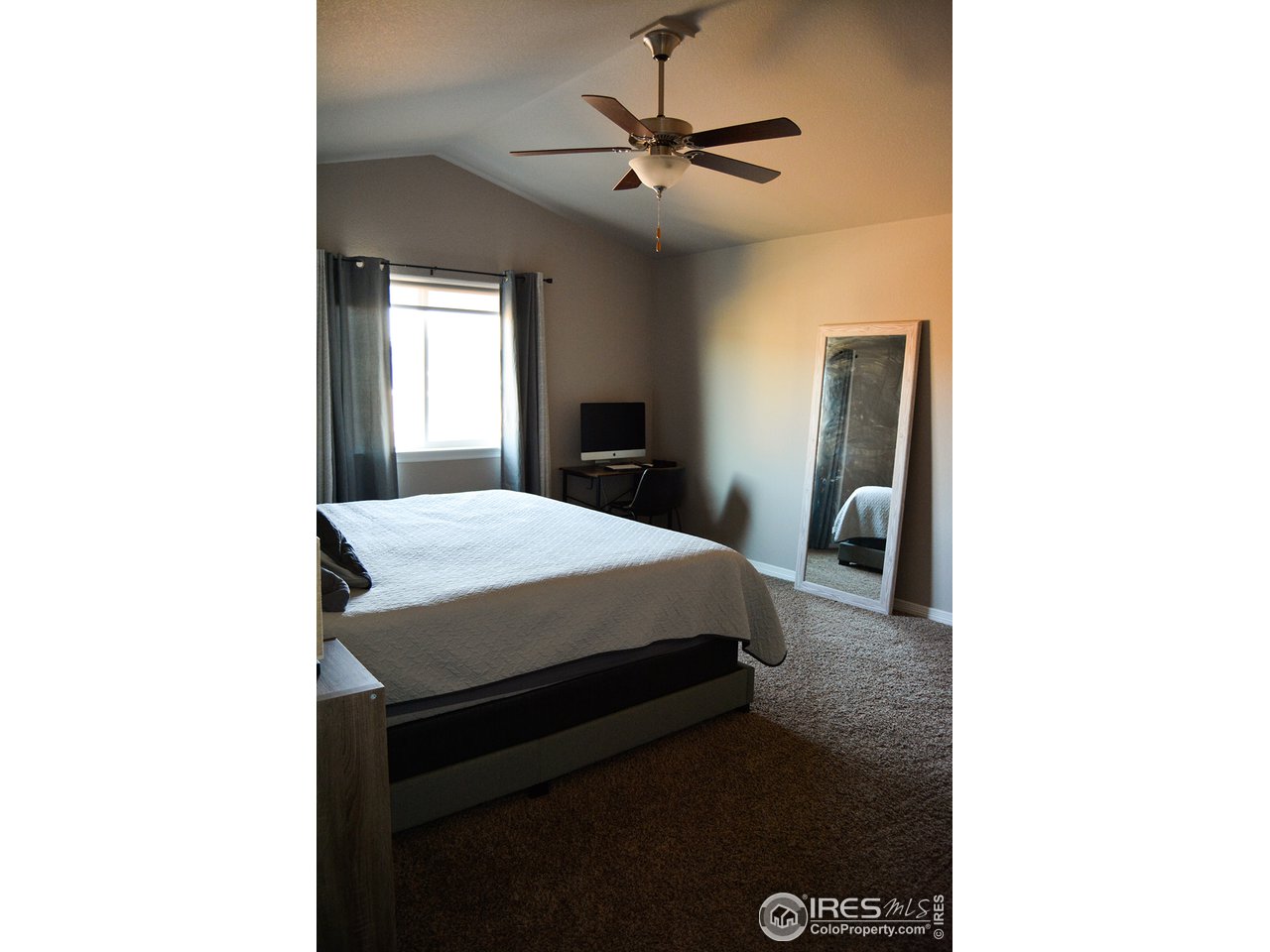 1389 Copeland Falls Road Severance, CO 80550 - Photo 17 of 38 Owners' retreat with vaulted ceiling and fan.