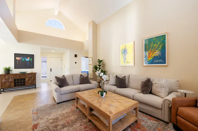 a kitchen with stainless steel appliances a stove microwave and cabinets