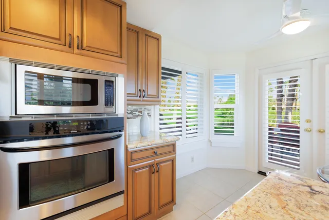 a bathroom with double sink and a mirror