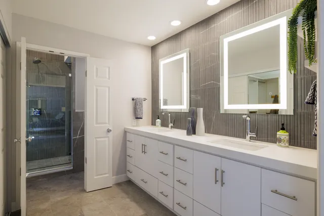 a bathroom with a tub sink and a mirror