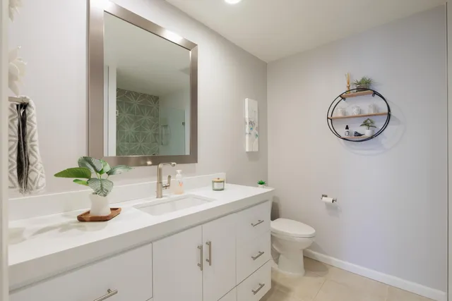 a view of a patio with couches and potted plants
