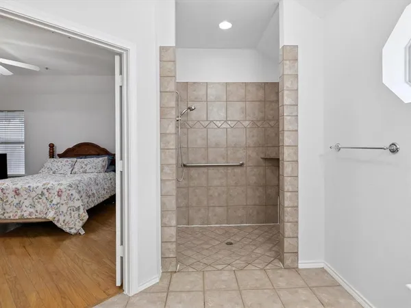 a bedroom with a bed and a shower