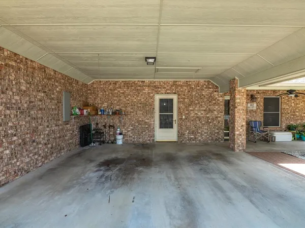 a view of a backyard with wooden fence
