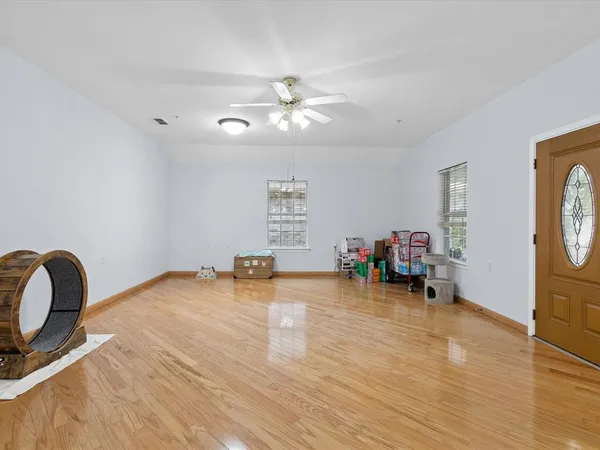 a view of a room with window and furniture