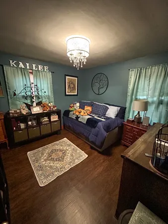 a view of a livingroom with furniture and a chandelier