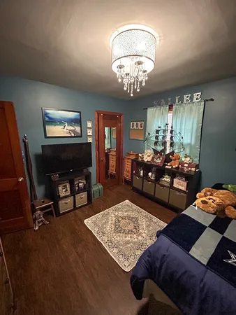 a kitchen with a refrigerator and a table