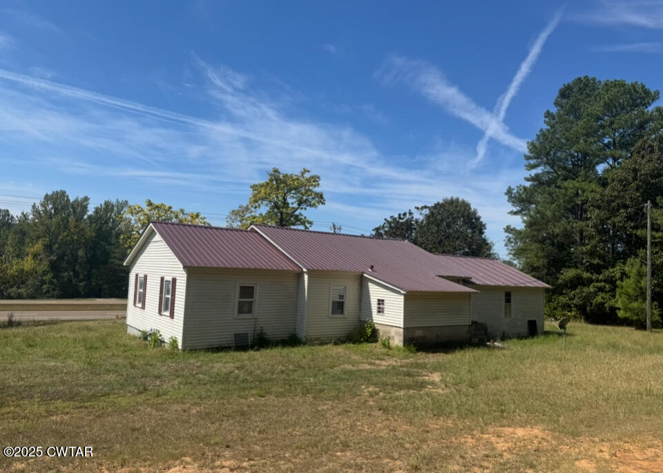 4667 Highway 64 Selmer, TN 38375 - Photo 2 of 10 a view of a house with a yard