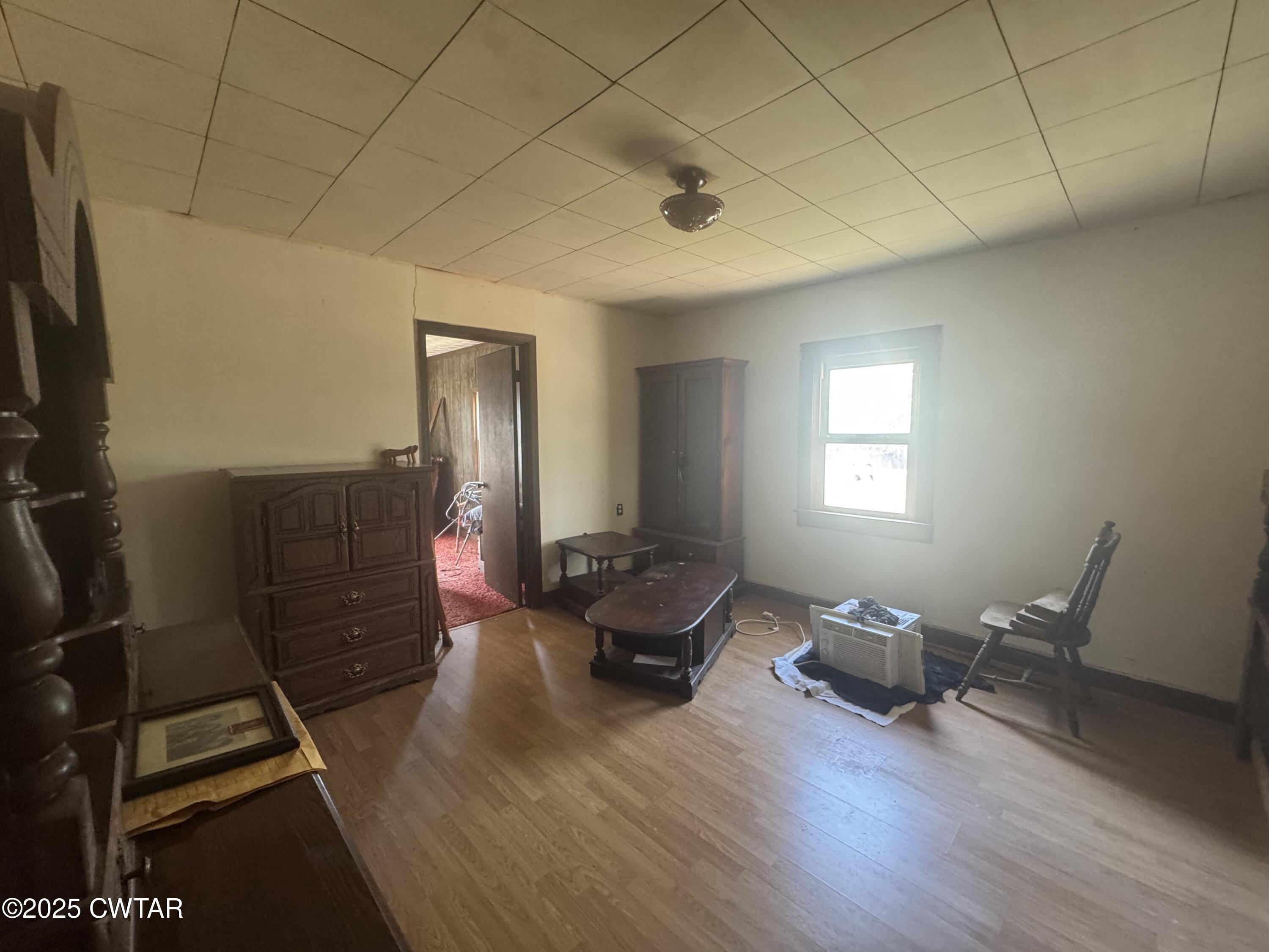 4667 Highway 64 Selmer, TN 38375 - Photo 6 of 10 a living room with furniture and a flat screen tv