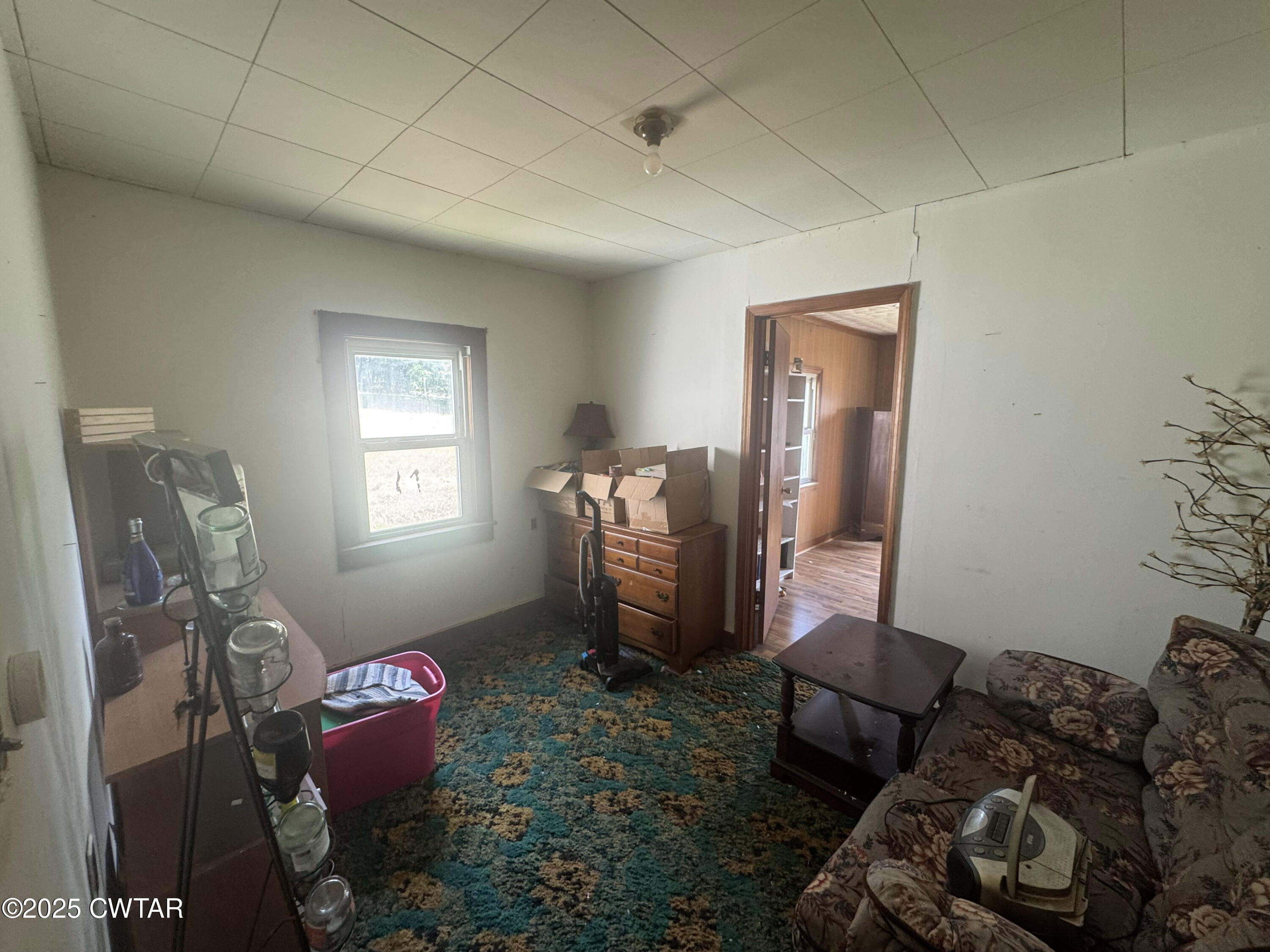 4667 Highway 64 Selmer, TN 38375 - Photo 9 of 10 a living room with furniture and a window