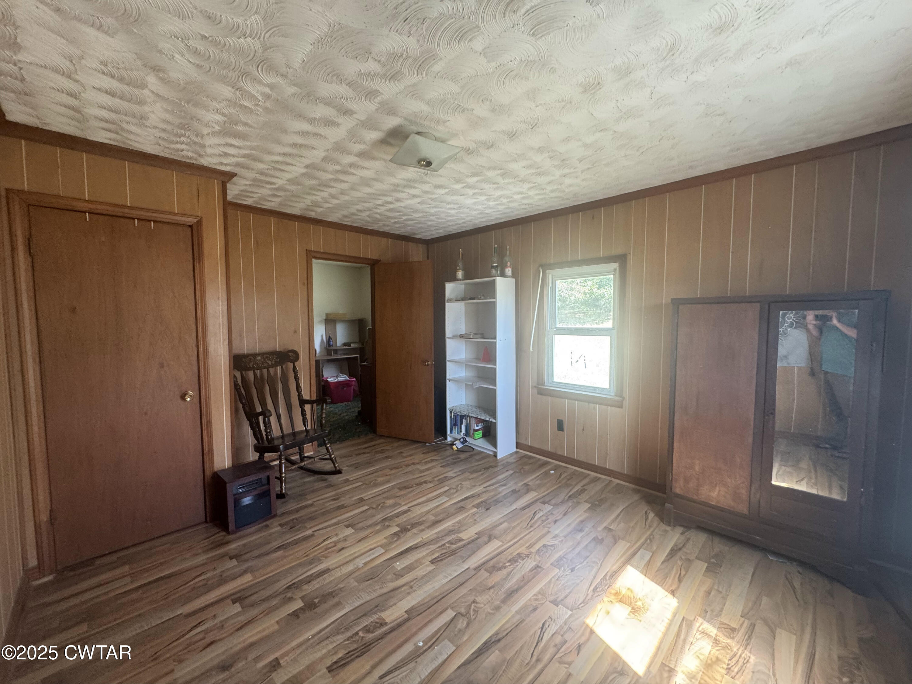 4667 Highway 64 Selmer, TN 38375 - Photo 10 of 10 a view of a room with wooden floor and furniture