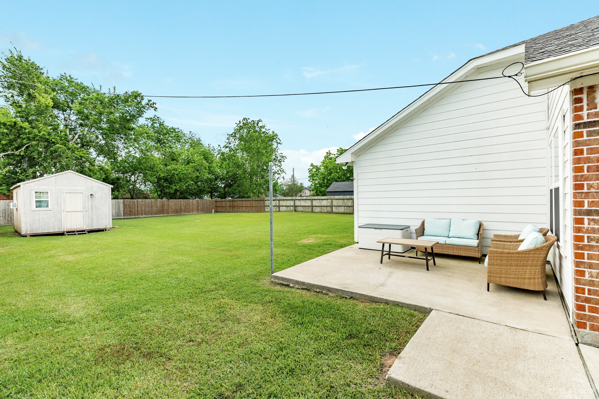 6108 Fox Ridge Drive Angleton, TX 77515 - Photo 23 of 26 a view of a backyard with sitting area