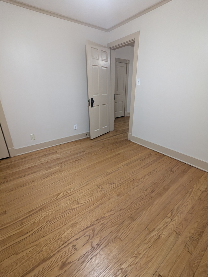 328 West St Charles Road, Unit B2 Lombard, IL 60148 - Photo 14 of 26 a view of an empty room and wooden floor