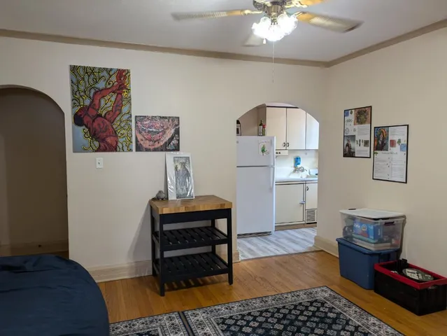 a bedroom with furniture and a rug