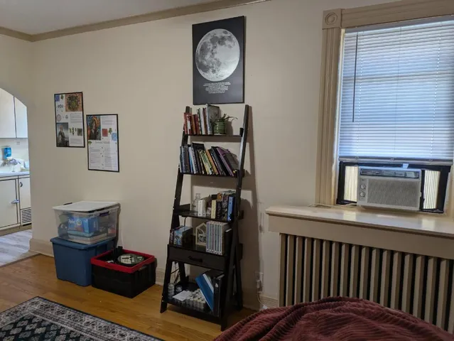 a bedroom with furniture and a closet