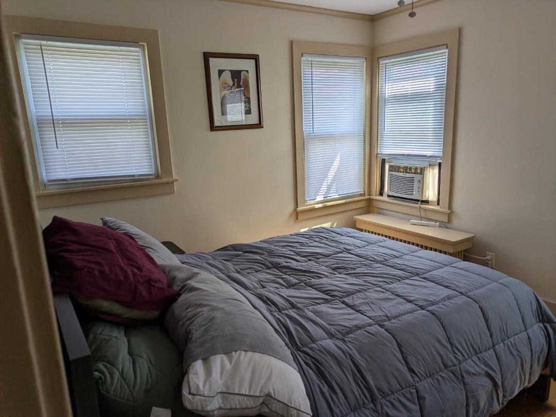 328 West St Charles Road, Unit B2 Lombard, IL 60148 - Photo 5 of 26 a bed sitting in a bedroom next to a window