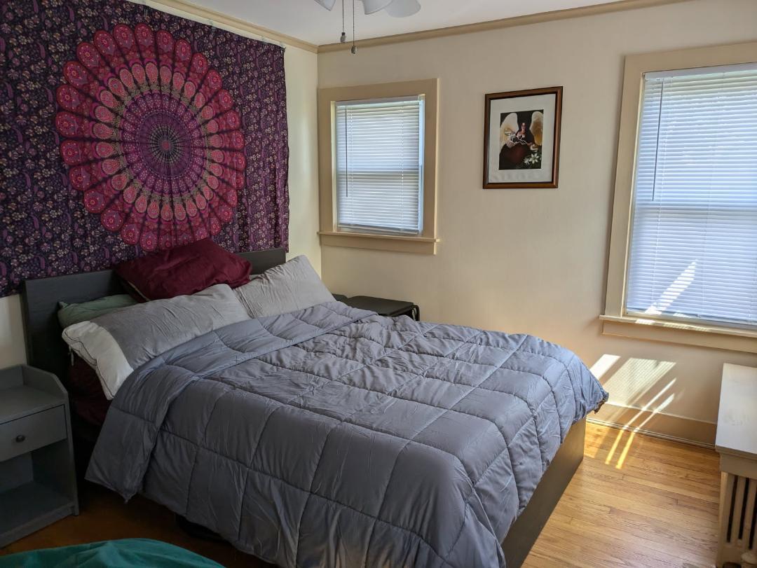 328 West St Charles Road, Unit B2 Lombard, IL 60148 - Photo 6 of 26 a bedroom with a bed and wooden floor