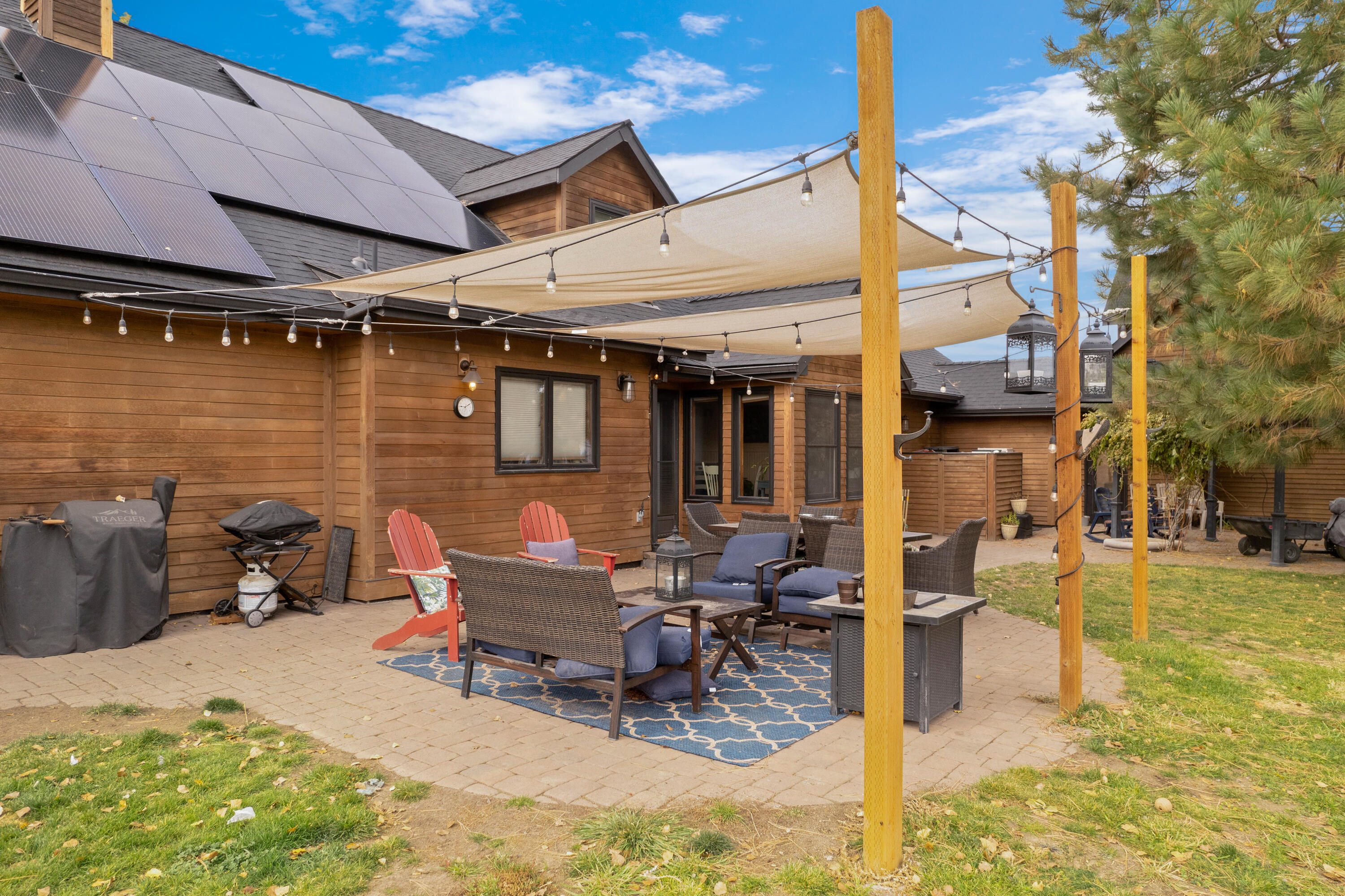 63520 Cricketwood Road Bend, OR 97701 - Photo 7 of 84 a view of a patio with a table and chairs and potted plants