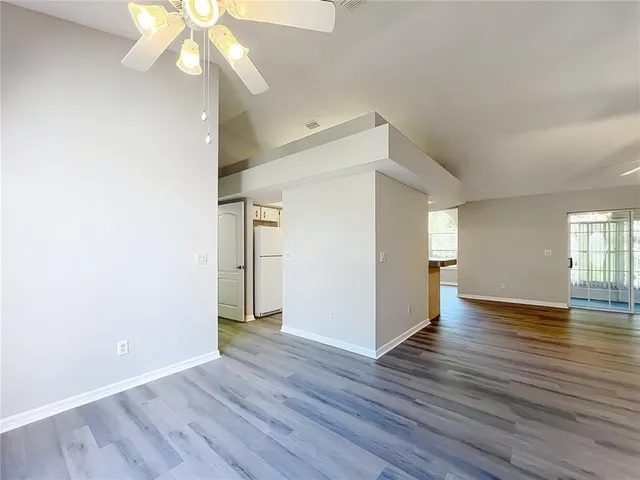 a kitchen with stainless steel appliances granite countertop a stove and a white cabinets