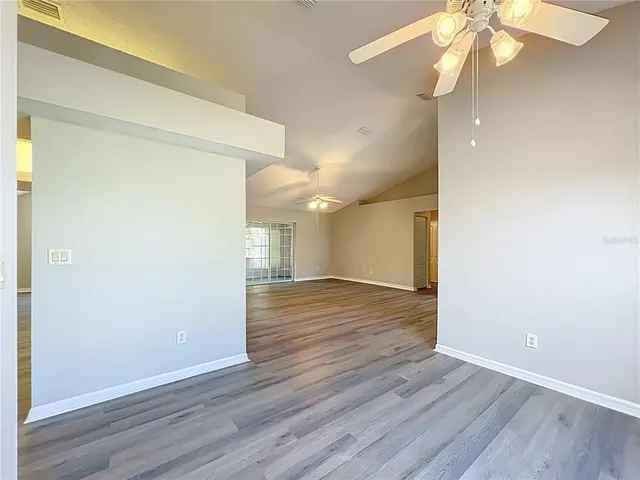 a kitchen with kitchen island granite countertop a stove and a sink