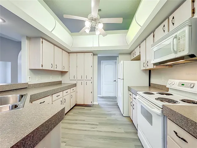 a bathroom with a granite countertop sink mirror and double