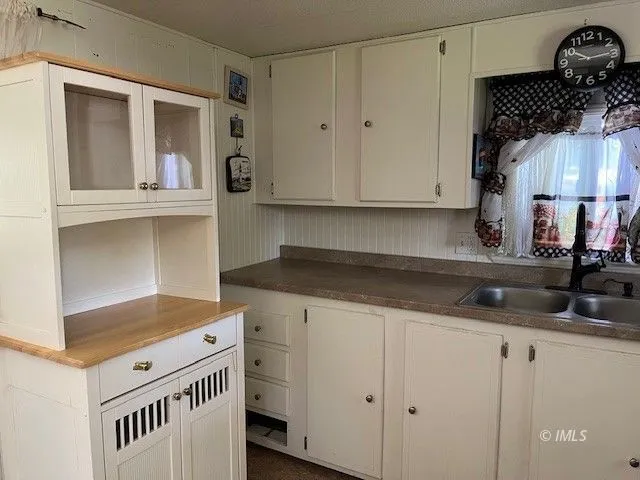 a kitchen with a sink and cabinets