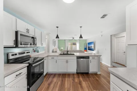 an aerial view of a house with swimming pool