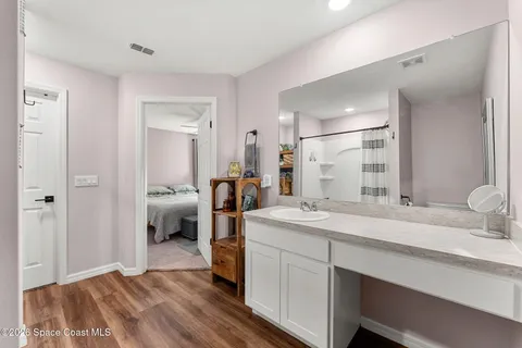a bathroom with a shower and a sink