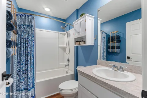 a white stove top oven sitting inside of a kitchen