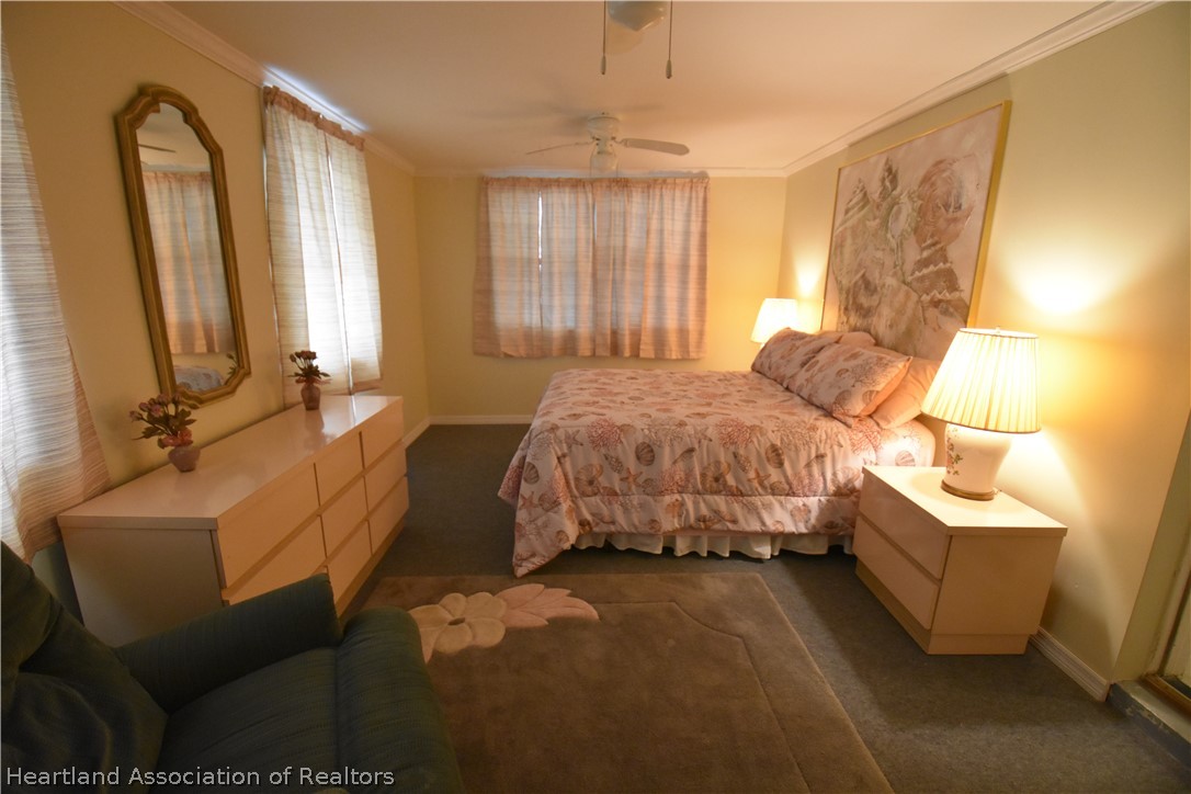 3906 Lakewood Road Sebring, FL 33875 - Photo 12 of 18 a bedroom with bed and window
