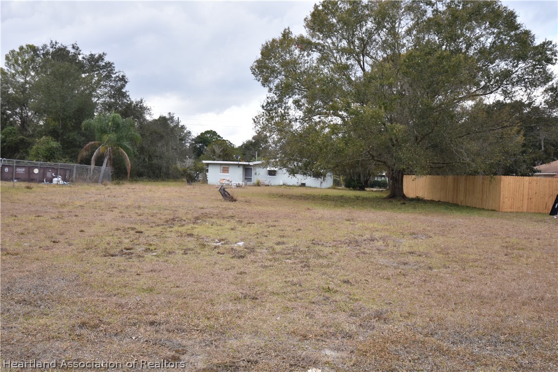 3906 Lakewood Road Sebring, FL 33875 - Photo 17 of 18 a view of a outdoor space with trees