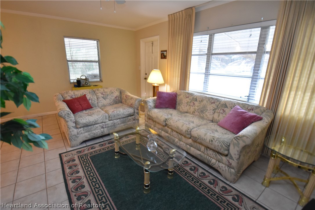3906 Lakewood Road Sebring, FL 33875 - Photo 6 of 18 a living room with furniture and a window