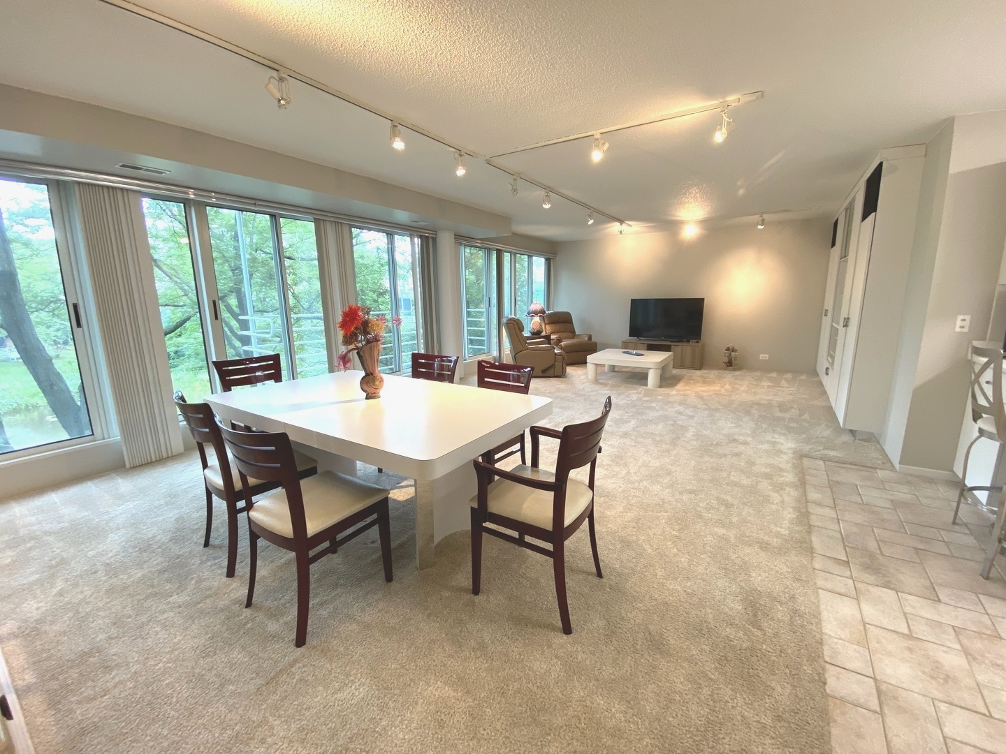 2555 Gross Point Road, Unit 203 Evanston, IL 60201 - Photo 2 of 24 a view of a dining room with furniture window and outside view