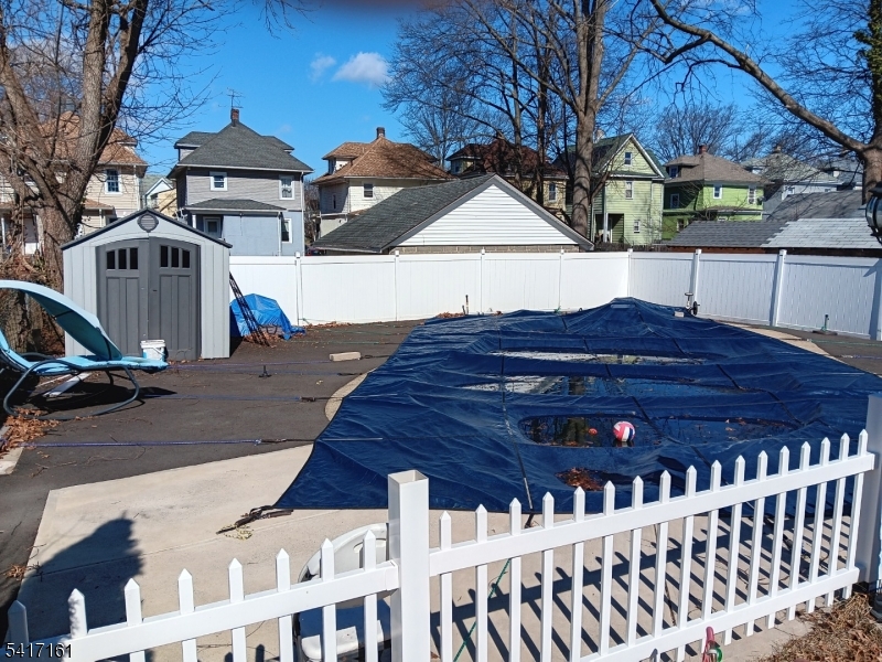 1028 West 5th Street Plainfield, NJ 07063 - Photo 12 of 13 a view of a house with wooden fence