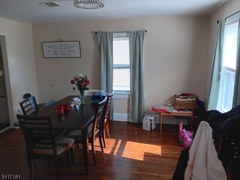 1028 West 5th Street Plainfield, NJ 07063 - Photo 2 of 13 a view of a dining room with furniture and window