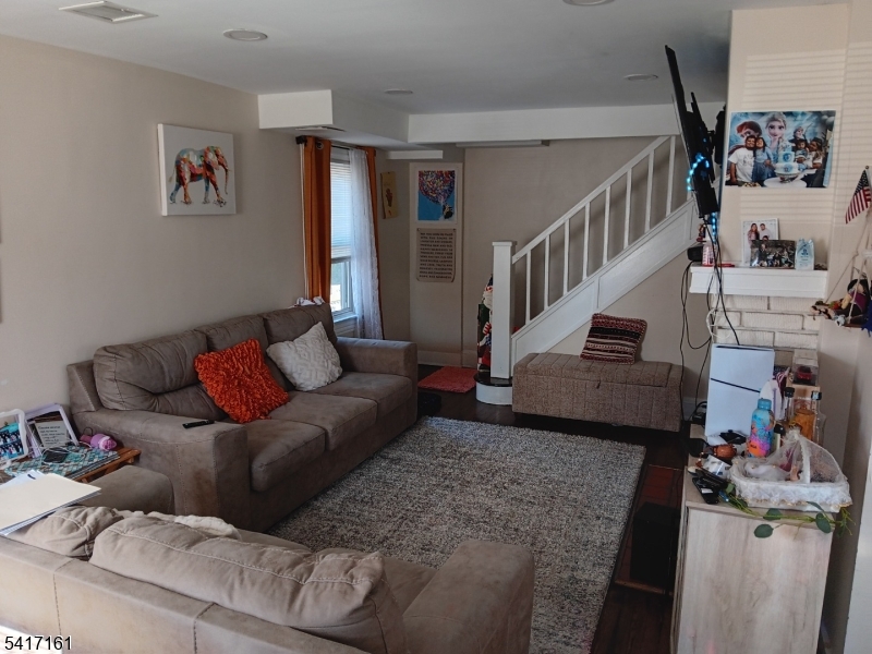 1028 West 5th Street Plainfield, NJ 07063 - Photo 5 of 13 a living room with furniture and a couch