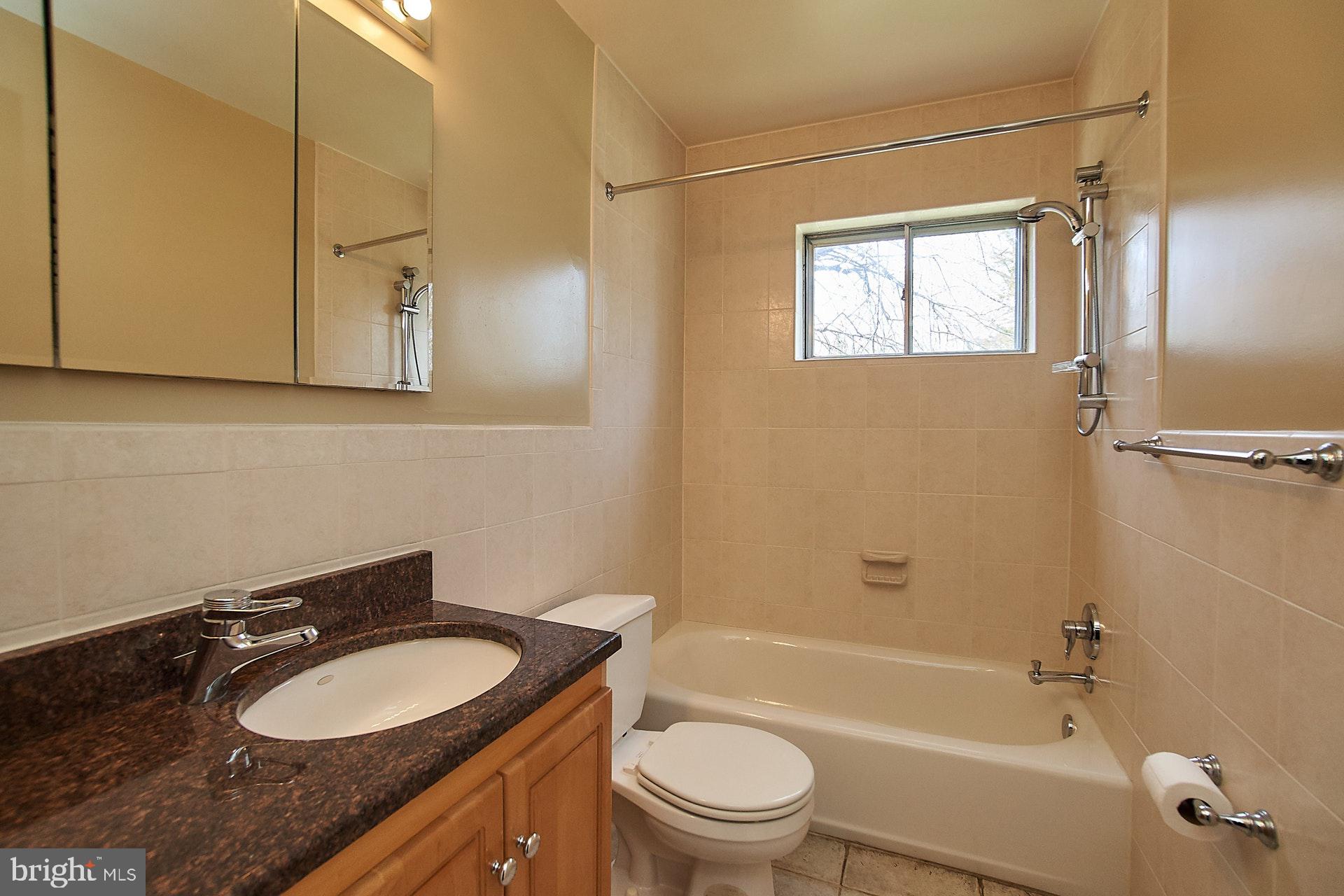 6541 Kerns Road Falls Church, VA 22044 - Photo 17 of 28 Tiled Hall bath with adjustable shower head
