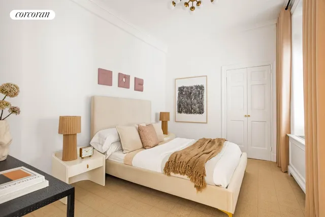 a bedroom with a bed and a night stand