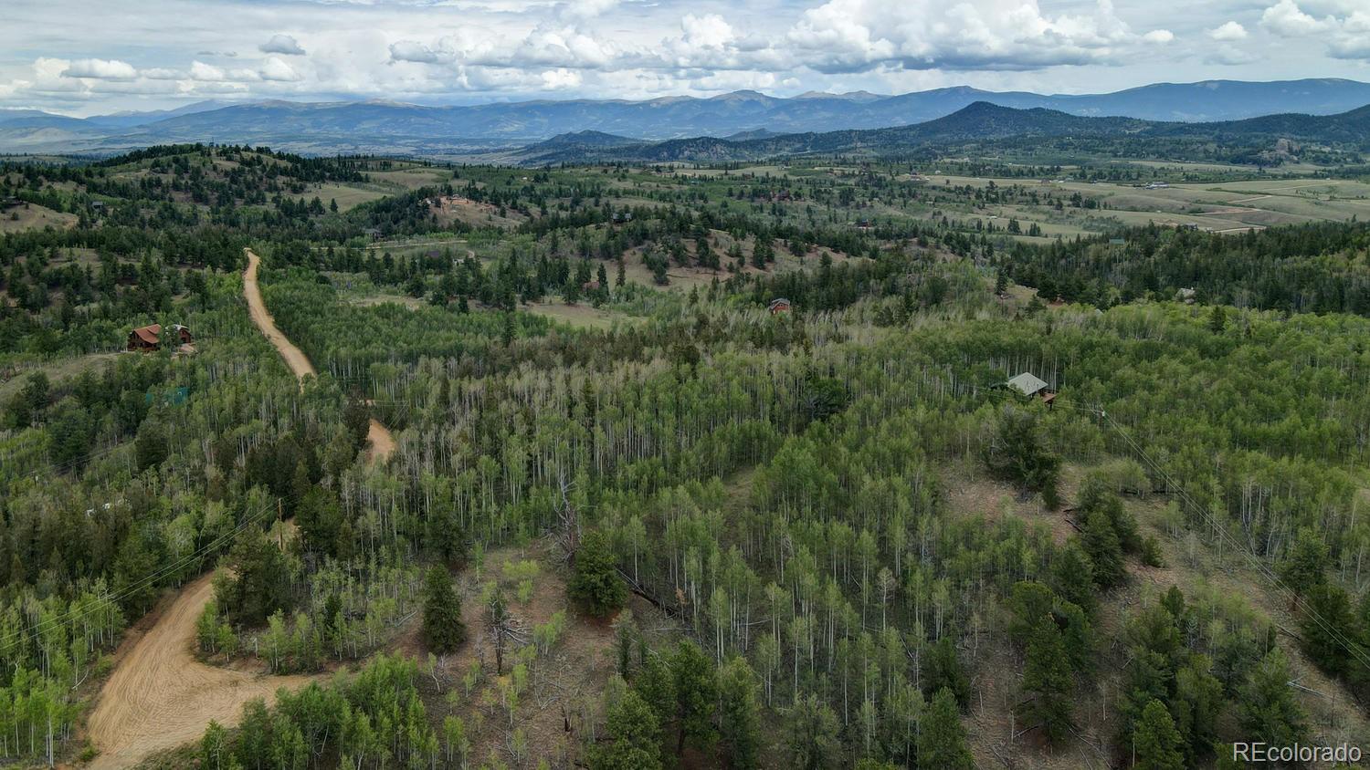 1018 Osprey Road Como, CO 80432 - Photo 6 of 13 a view of a city with lush green forest