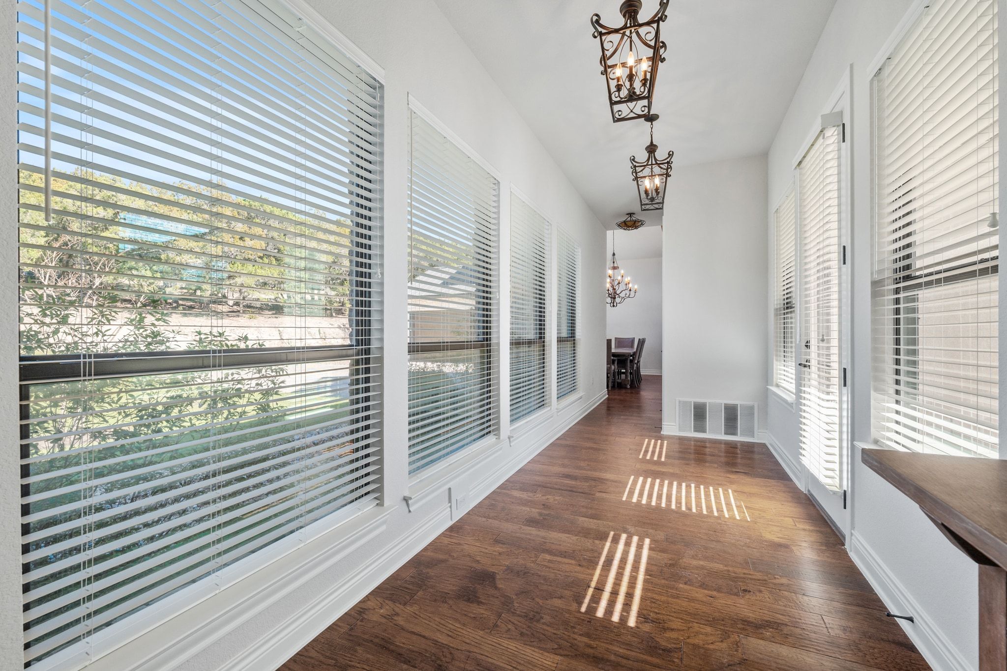 20607 Thurman Bend Road Spicewood, TX 78669 - Photo 19 of 39 a view of a room with wooden floor