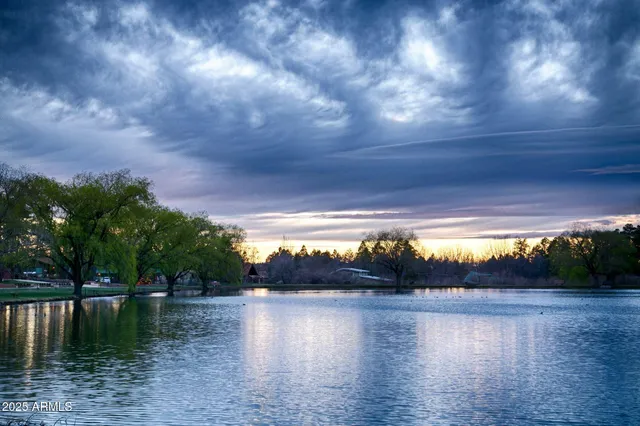 a view of a lake with a yard