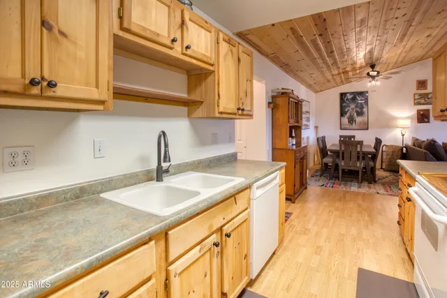 a living room with furniture flat screen tv and a fireplace