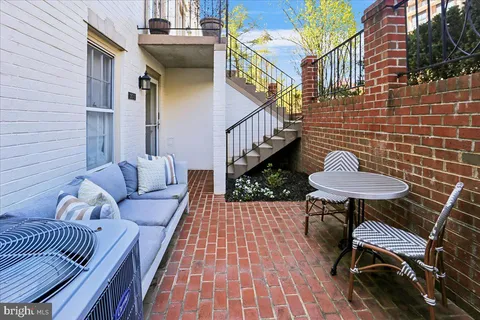 a view of a chairs and table in the patio
