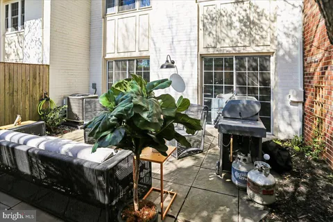 a table and chairs in front of a house