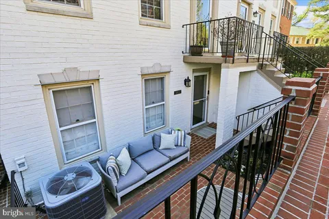 a view of a balcony with furniture