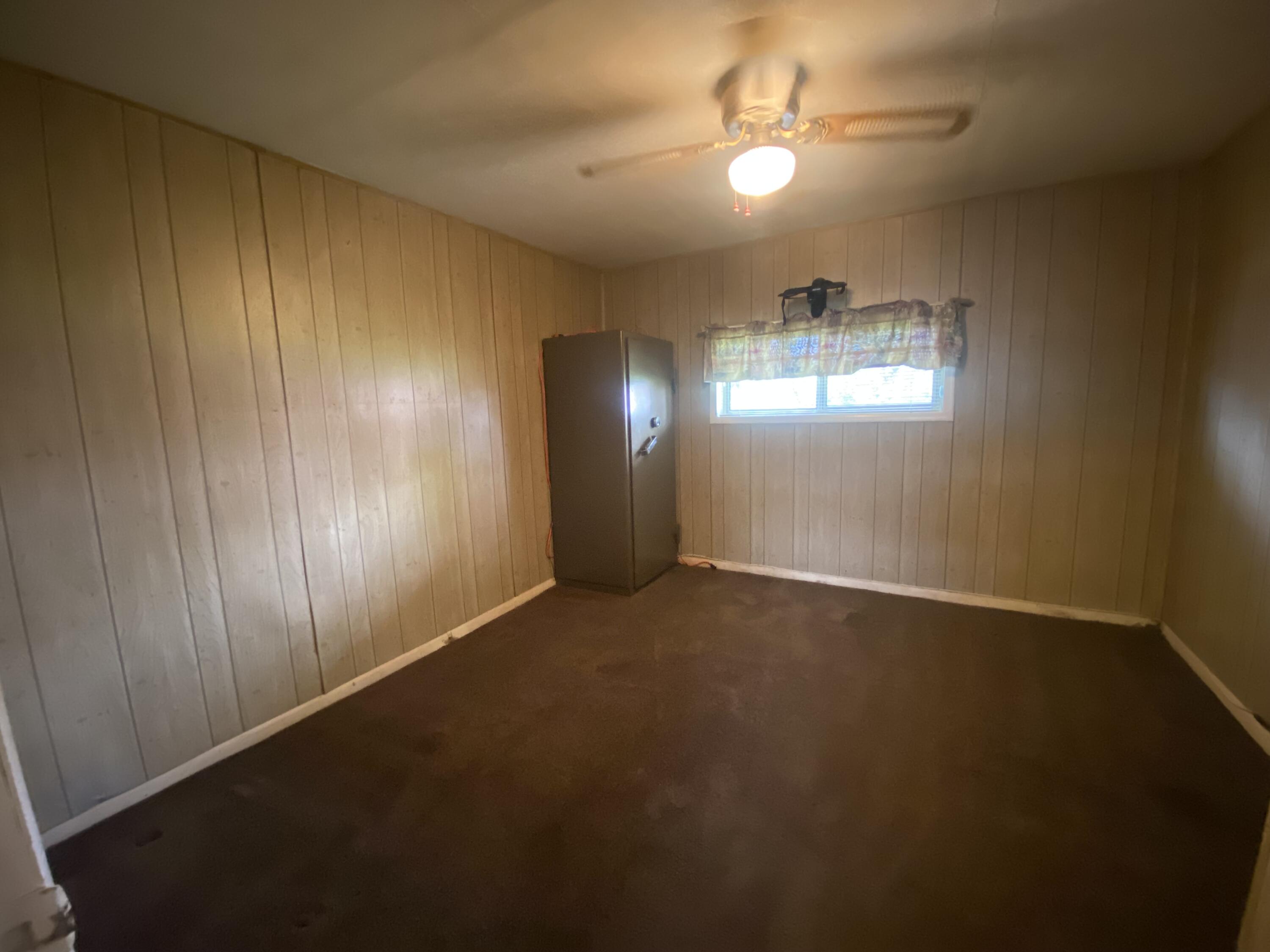 230 Myrtle Street Chester, CA 96020 - Photo 27 of 46 a view of empty room with windows and ceiling fan