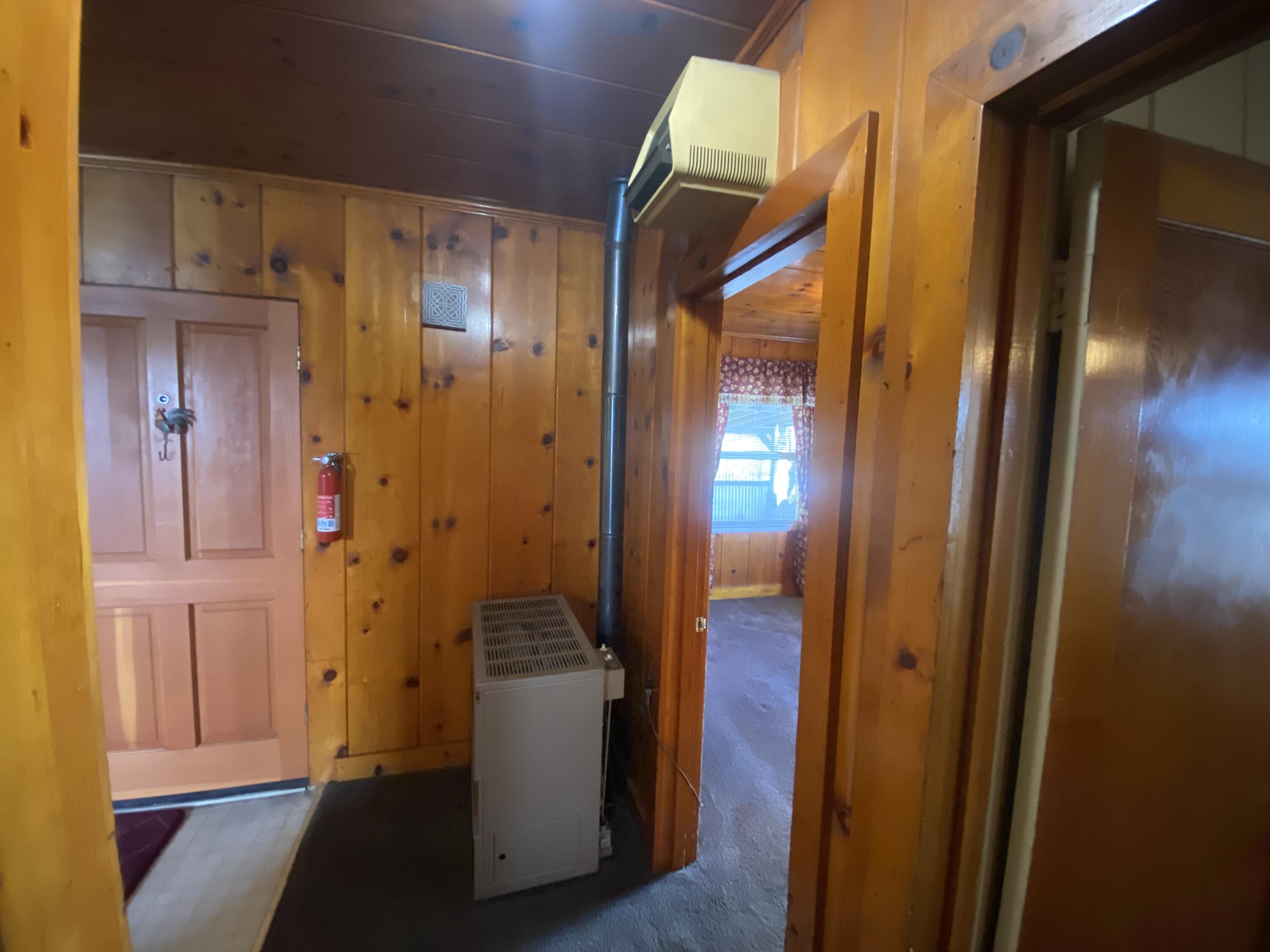 230 Myrtle Street Chester, CA 96020 - Photo 8 of 46 a view of hallway with livingroom and wooden floor
