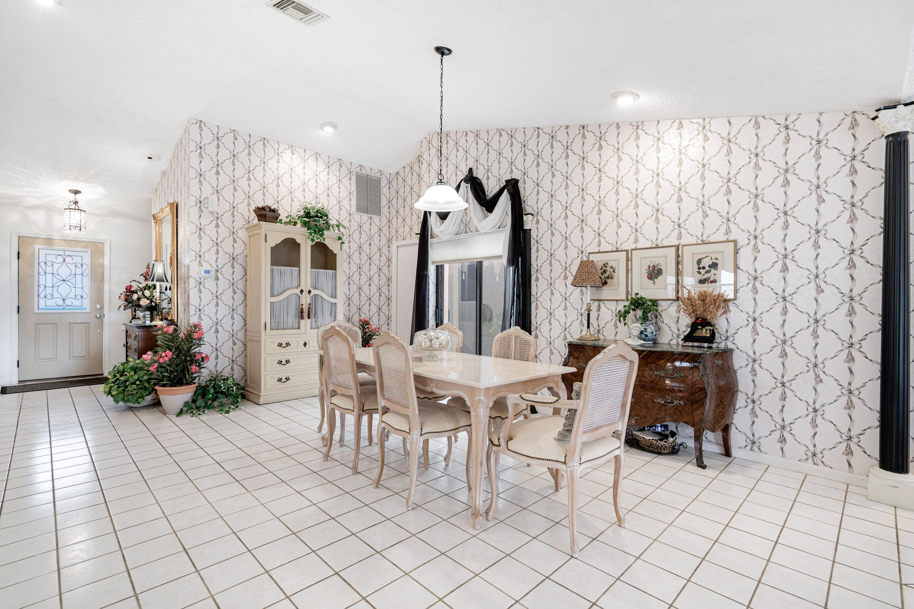 861 Camino Gardens Lane Boca Raton, FL 33432 - Photo 12 of 37 a view of a dining room with furniture